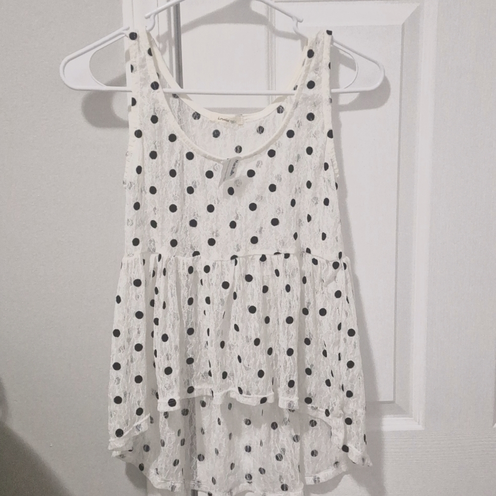 Two brand new blouses (white and black polka-dot and black and white stripes)